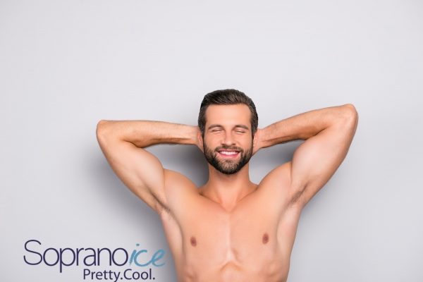 Attractive, stunning, manly, smiling macho isolated on gray background, having two arms behind the head and closed eyes, showing his shaven armpits – wellness, wellbeing concept